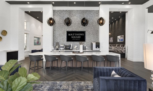 a community kitchen with a table and chairs