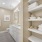 built-in shelving in well lit master bathroom