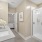 glass enclosed walk-in shower in master bathroom