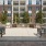 open outdoor dining area with grills and overhead string lights