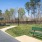 umbrella shaded seating in fenced-in bark park
