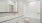 White cabinets and bright lit bathrooms