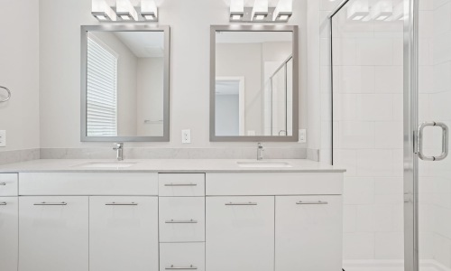 Bath area with mirrors bedroom with modern spaces